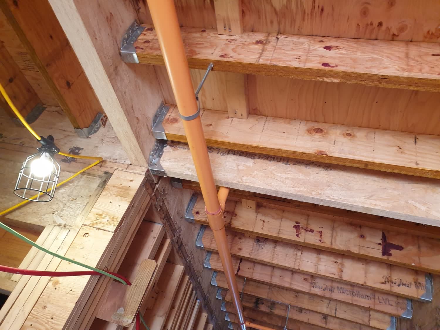 Framing and structural connections on a residential construction site in Greater Vancouver.