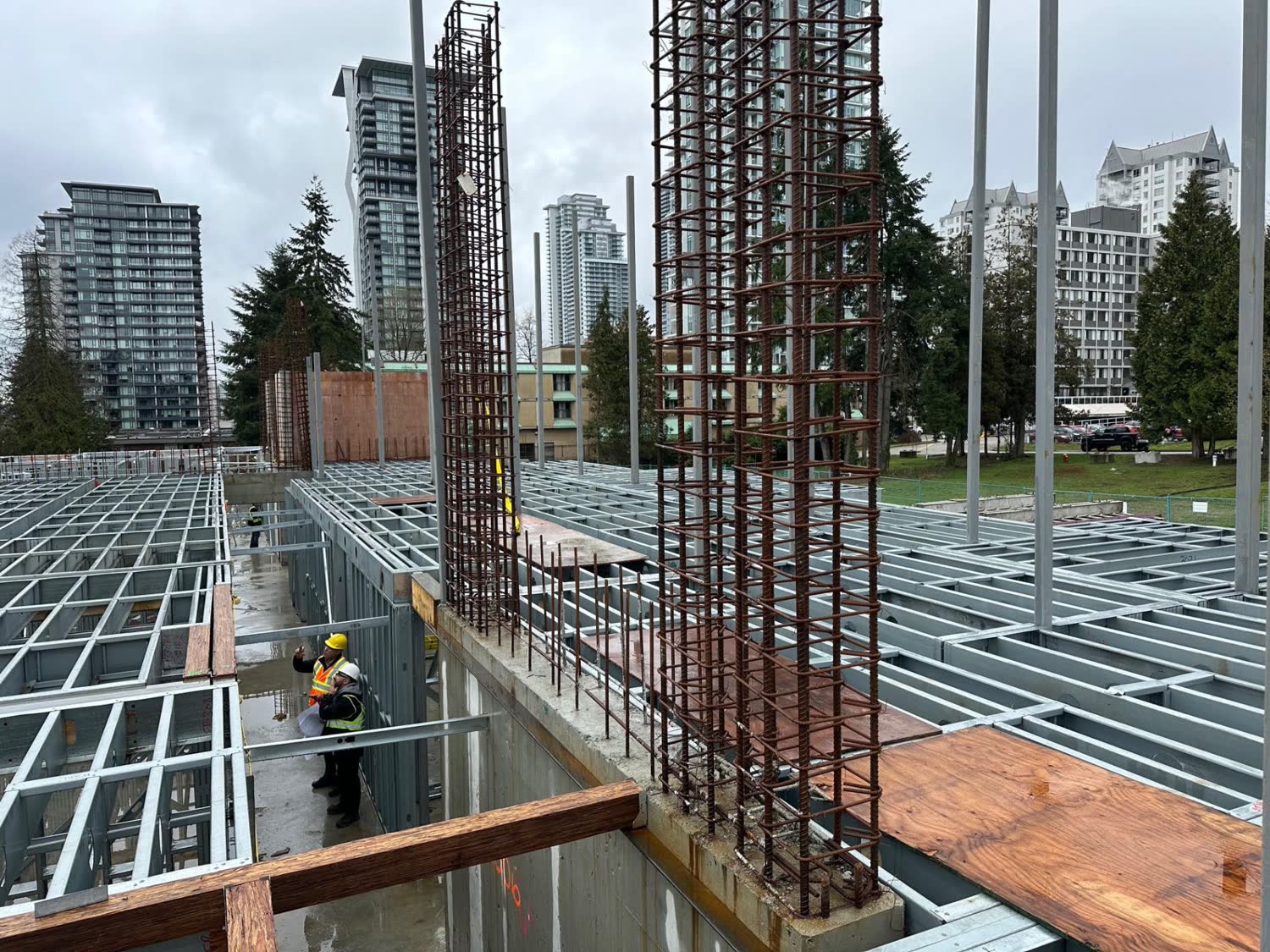 MAF structural engineers reviewing drawings on a multi-family construction site in Greater Vancouver